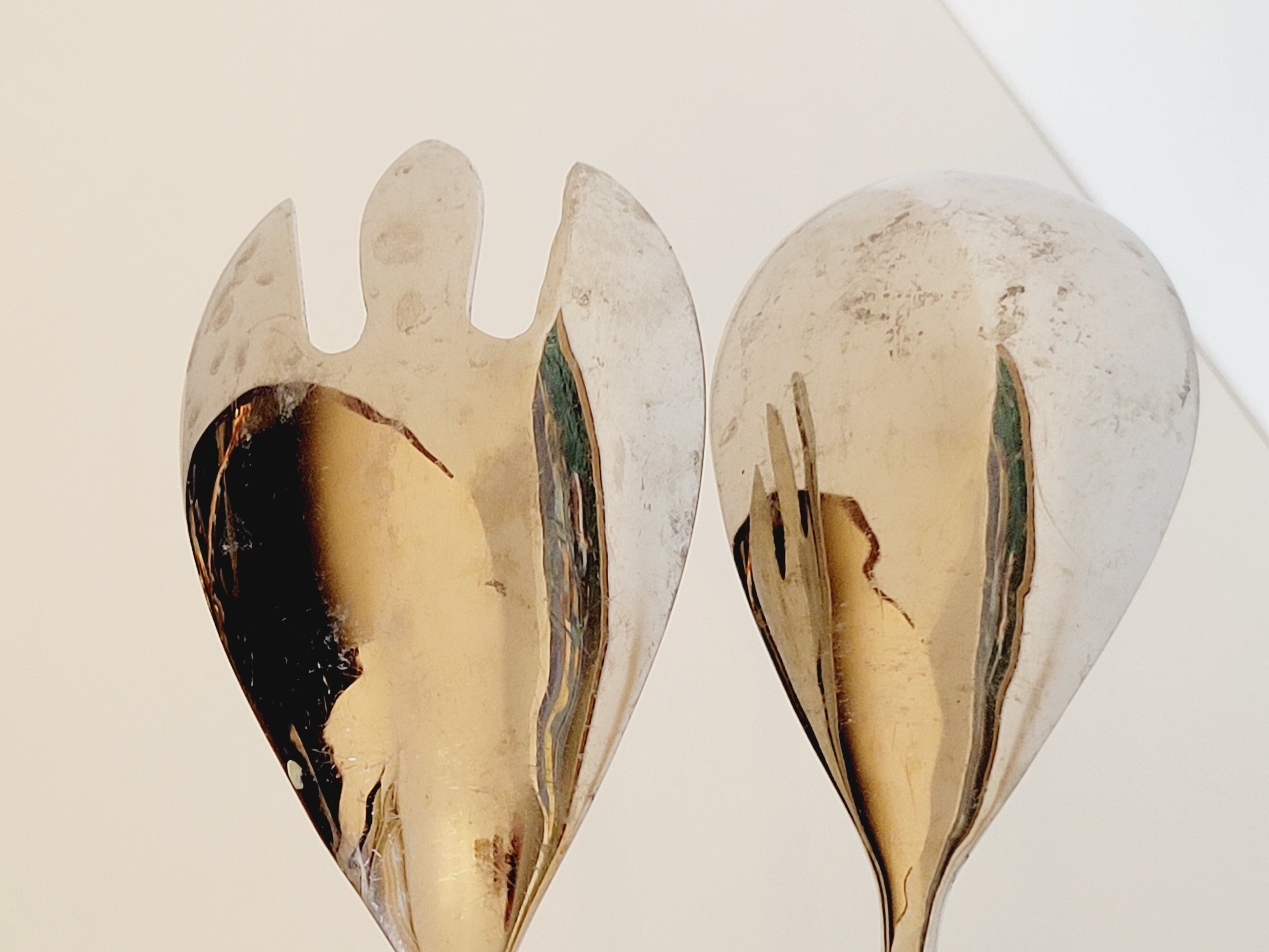 Set of salad serving cutlery in silver metal and resin