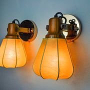 Pair of articulated "Cocoon" wall lights, resin and pine, Italy, 1970