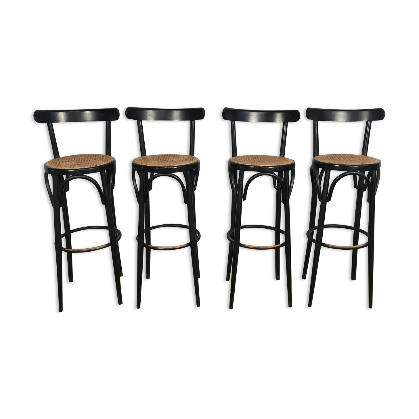 Suite de 4 tabourets de bar en cannage et bois noirci