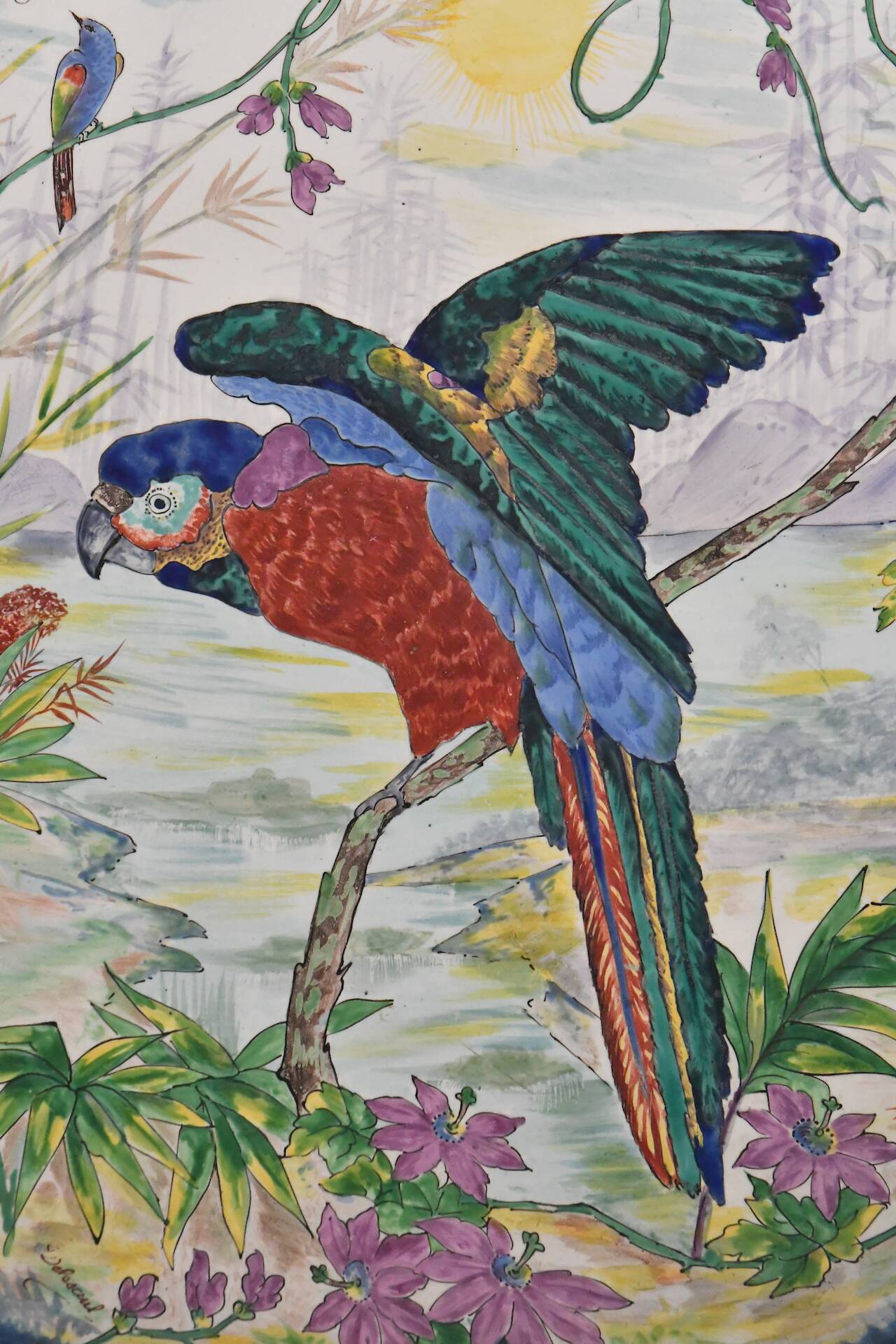 Large earthenware dish decorated with a parrot.