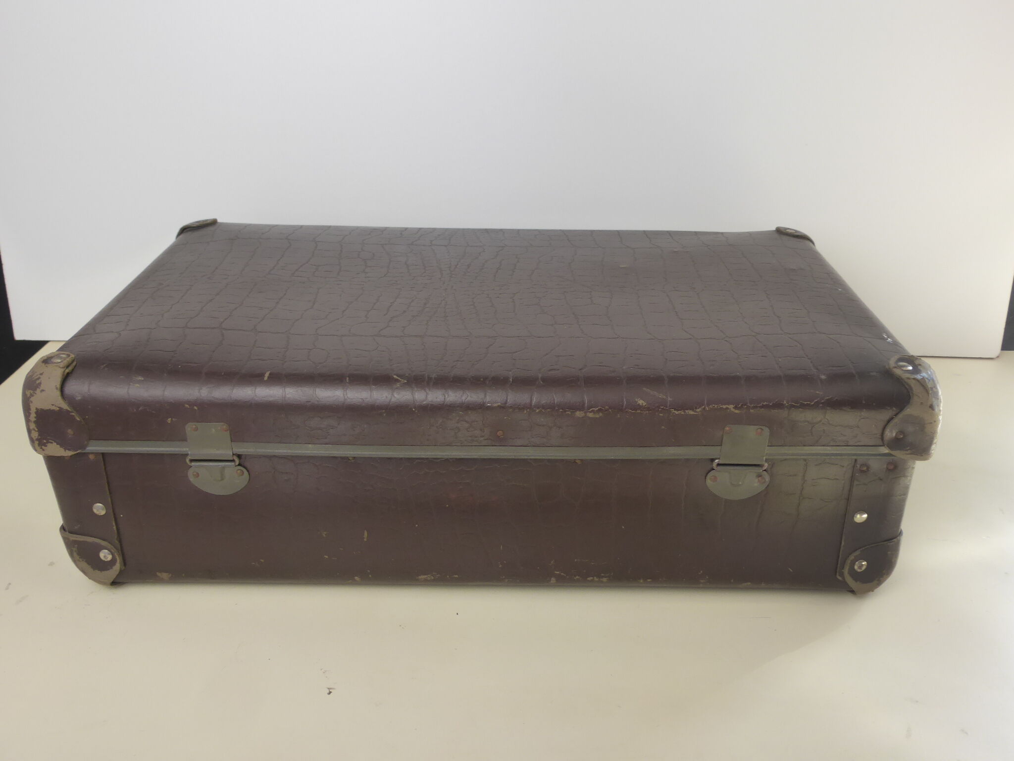 Old brown cardboard suitcase imitating the croco 50s/60s