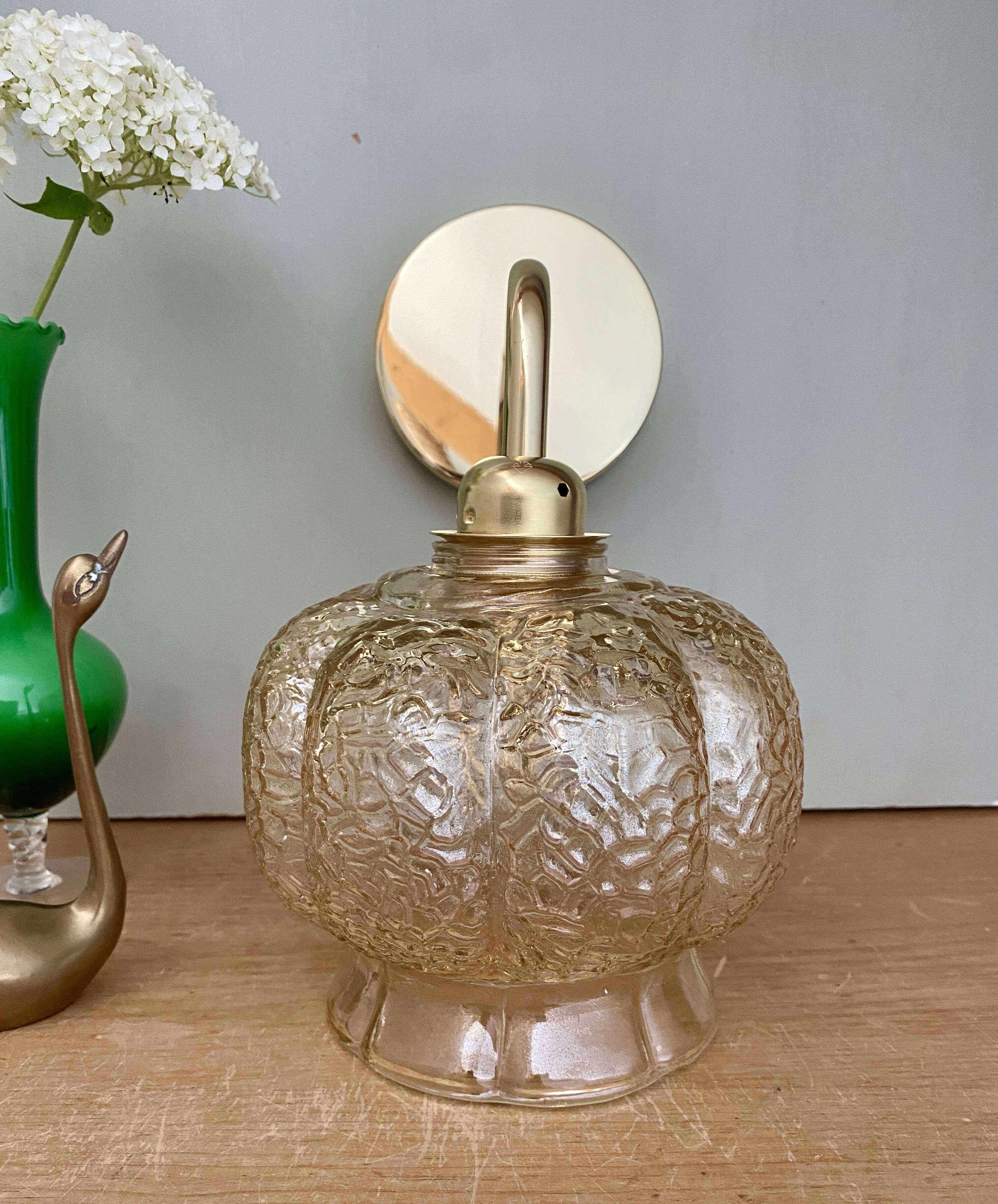 Vintage golden globe angled wall light in amber glass