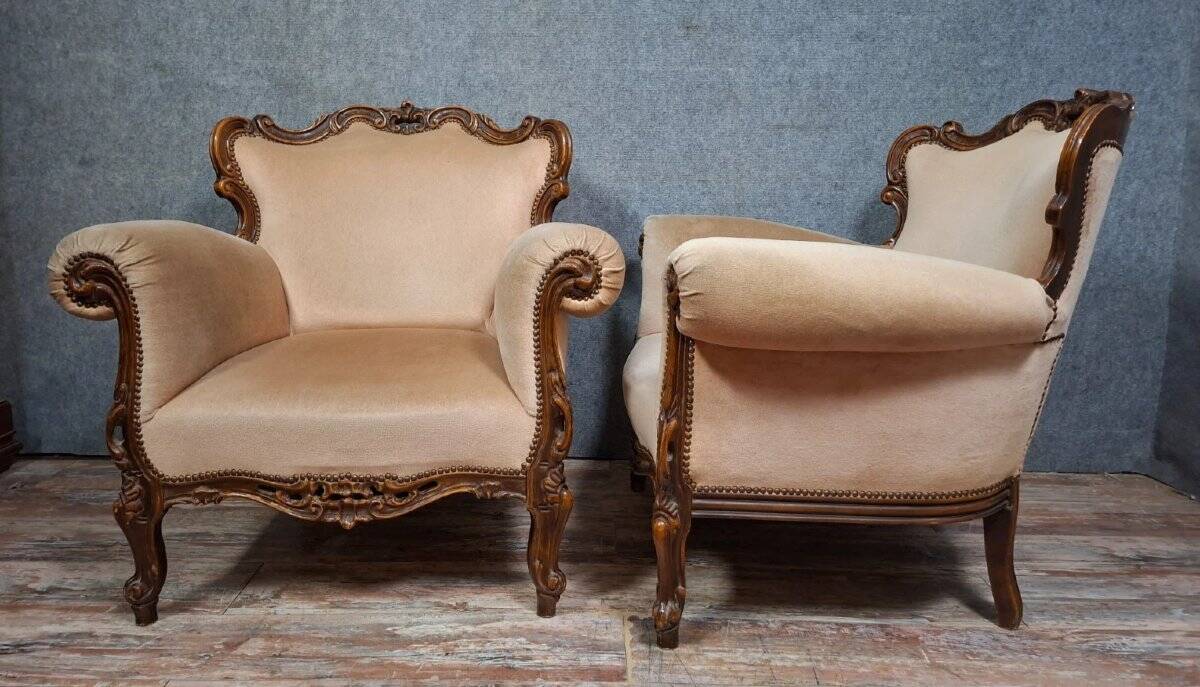 Pair of sculpted walnut armchairs – Louis XV style – 20th century