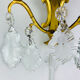 Bronze wall light with rococo style Louis XV pendants.