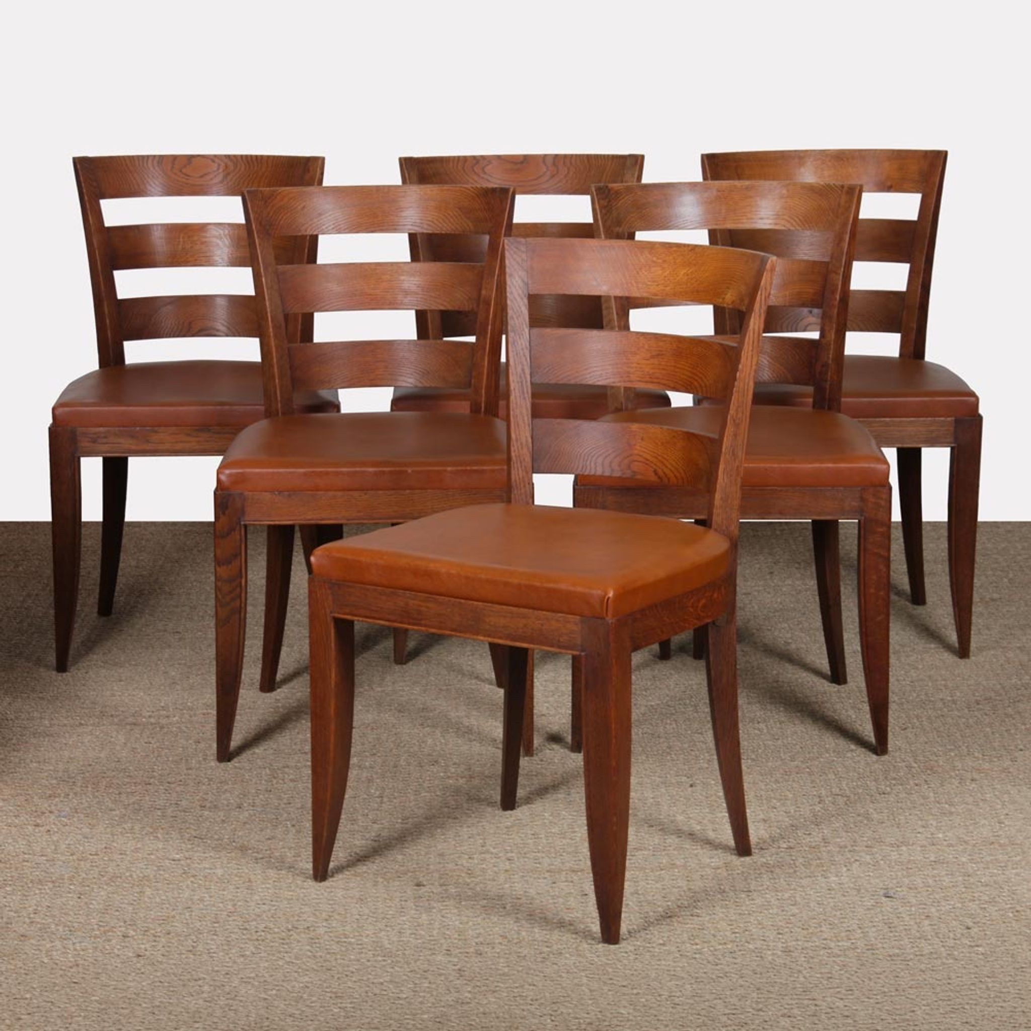 Set of 6 oak chairs in the style of Jean Pascaud, 1940.