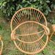 Paire de fauteuils coquille en rotin pieds acier
