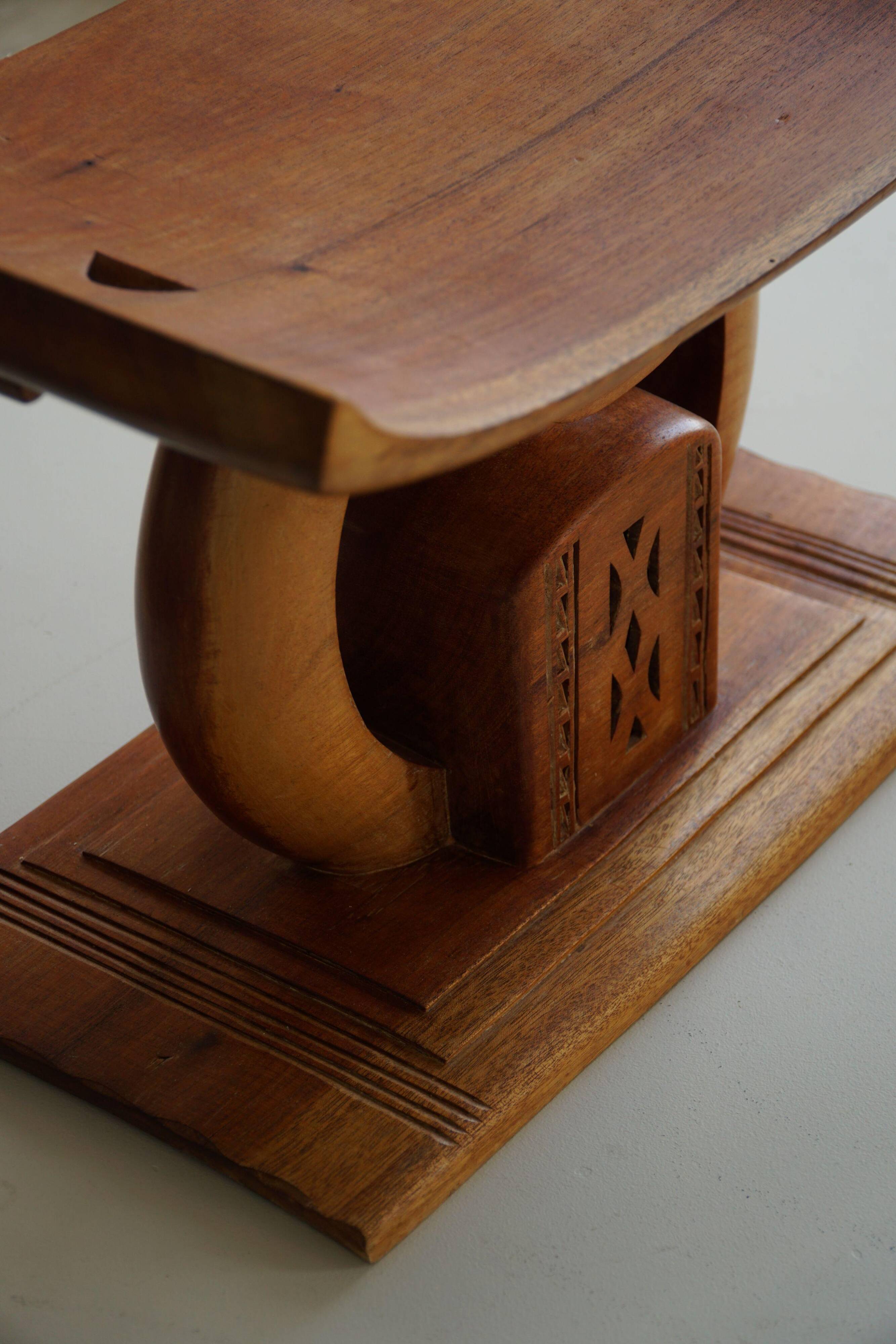 Ashanti stool from West Africa, carved from hardwood, 20th century.