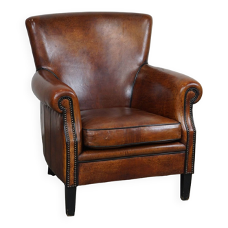 Very comfortable classic sheepskin leather armchair with beautiful warm colors