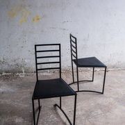 Set of 4 Black Steel Dining Chairs with Black Faux-Leather Seats — Minimalist Geometric Design