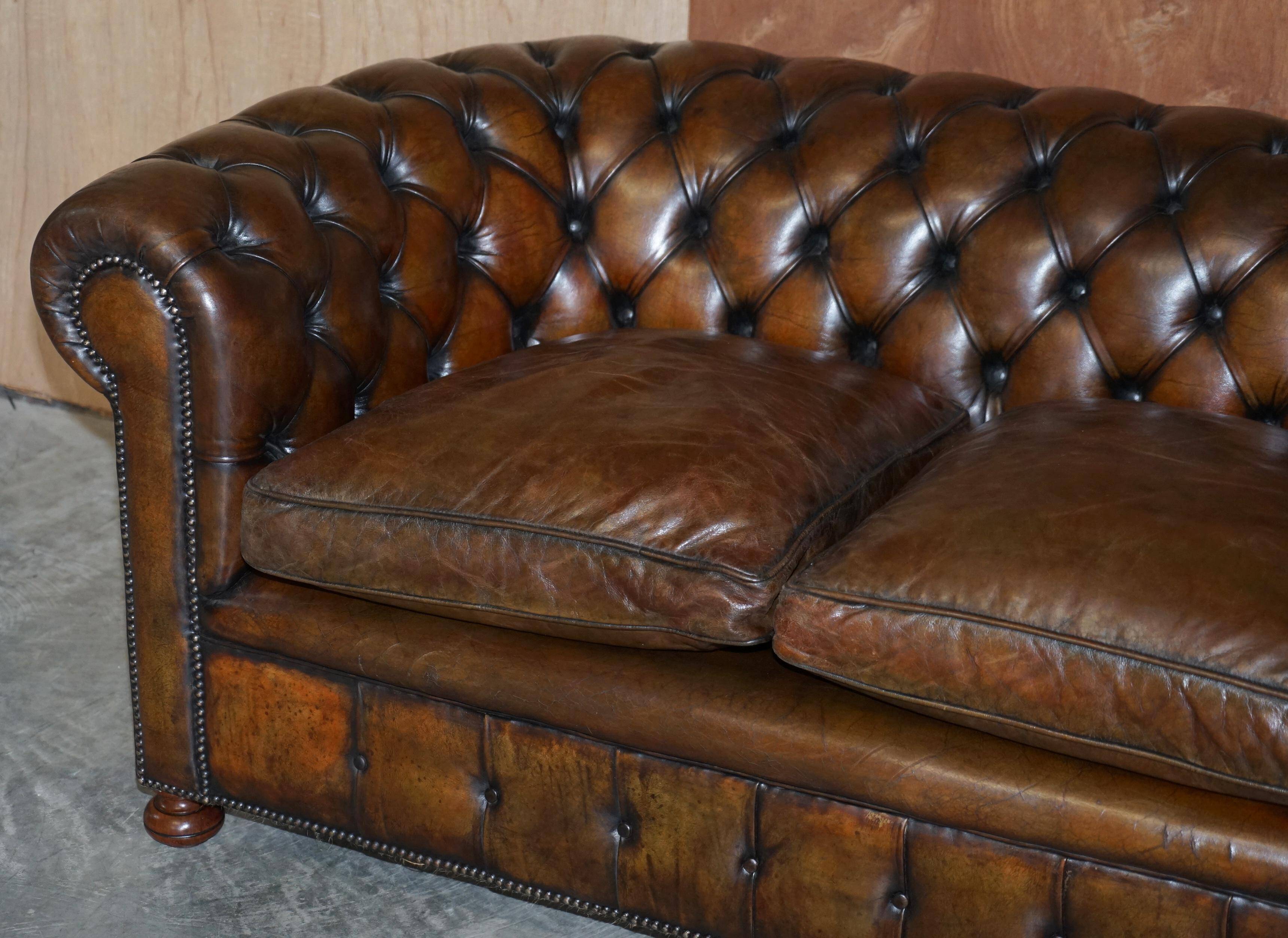 Restored leather Chesterfield sofa, walnut legs.