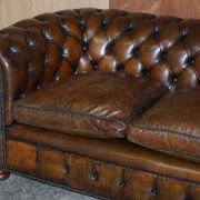 Restored leather Chesterfield sofa, walnut legs.