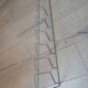 Metal wall-mounted magazine/book rack