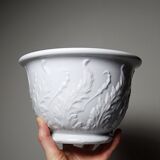 Antique cache-pot in Limoges porcelain with a relief decoration of foliage.