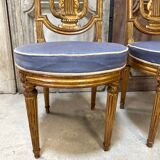 Paire de chaises style Louis XVI en bois doré