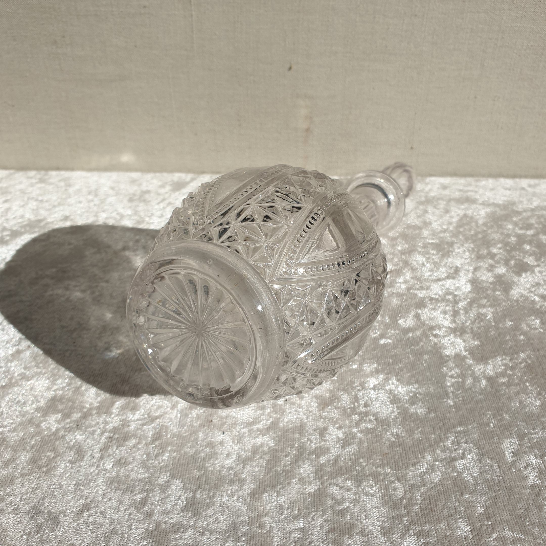 Old carafe in worked glass