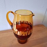 Carafe and its amber/gold glasses from the 70s