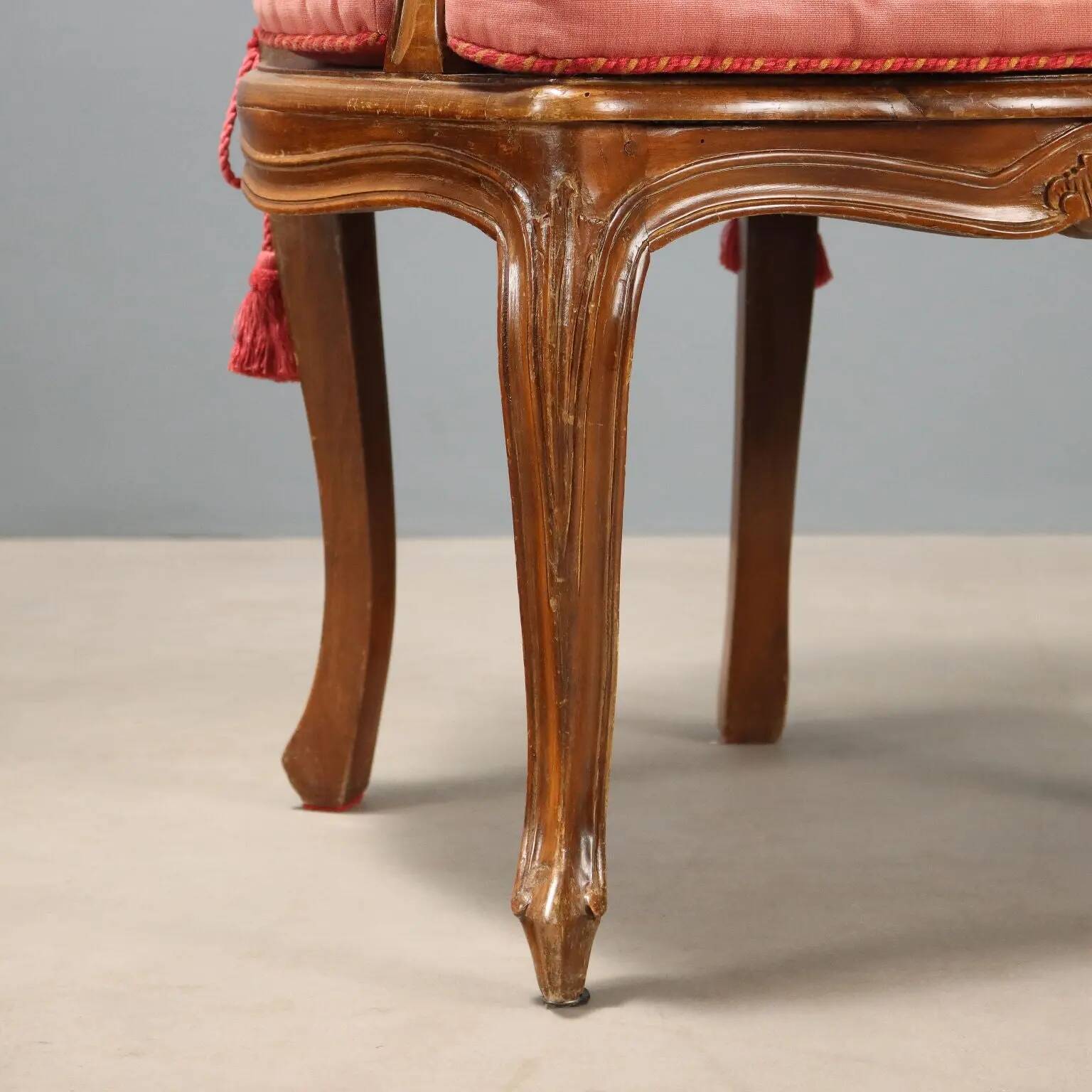 Antique baroque-style armchairs in walnut and fabric, 19th century.