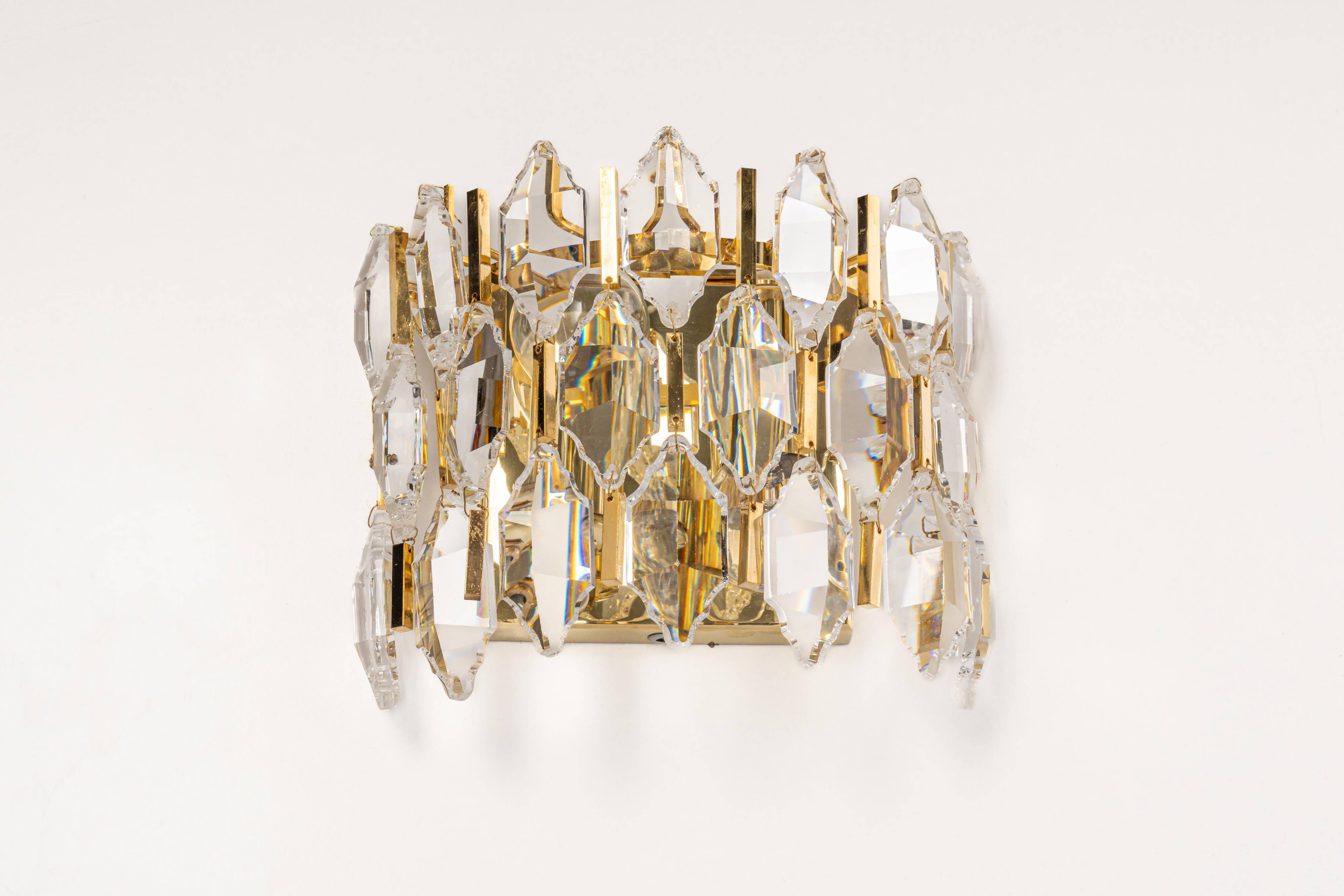 Pair of wall sconces in gilded brass and crystal by Palwa, Germany, 1970s.