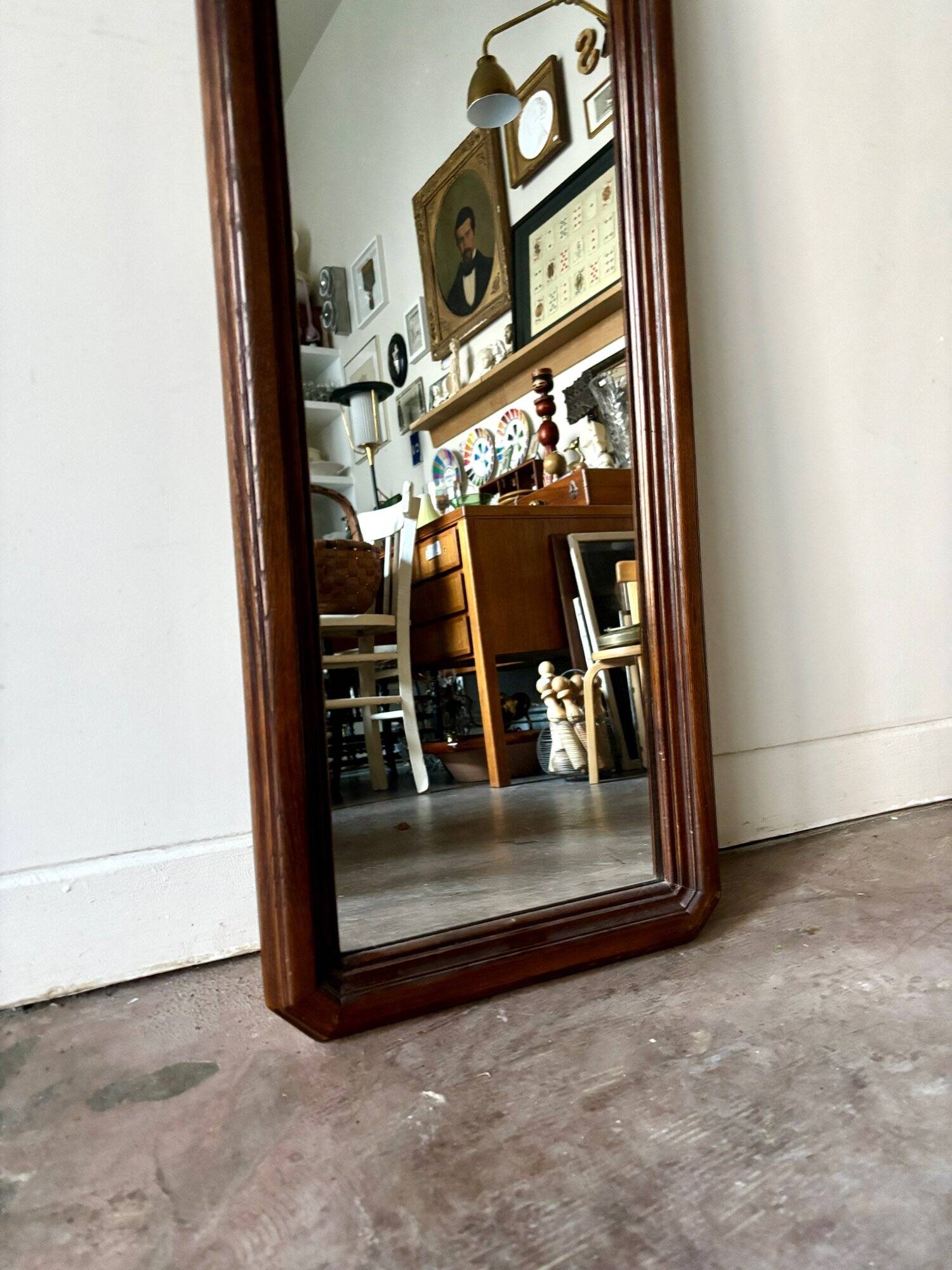 Full-length rectangular mirror in dark wood