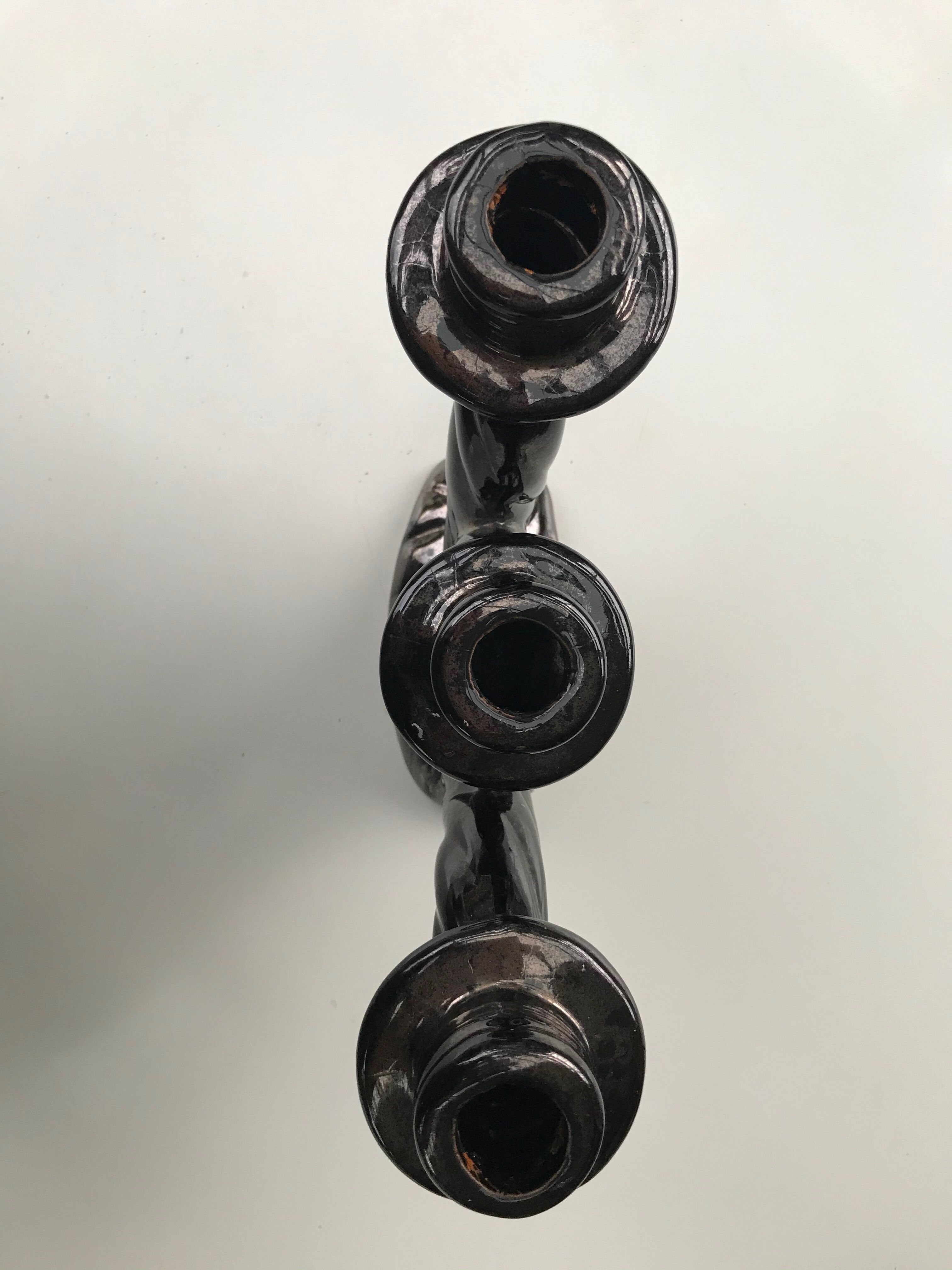 Former black ceramic candlestick signed Vallauris