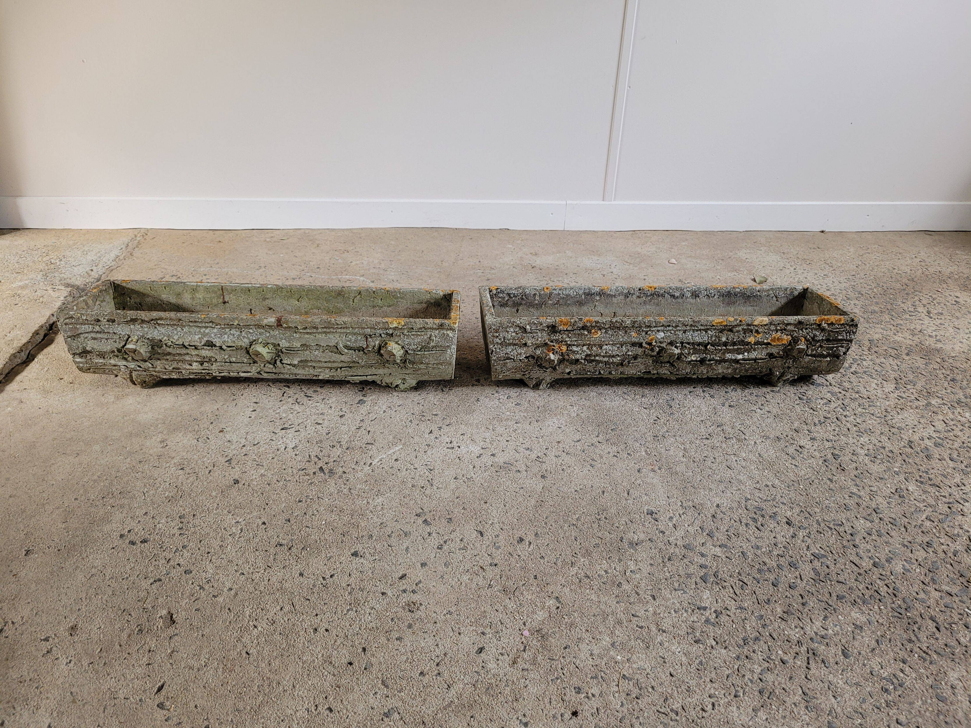 Old planters in faux cement wood