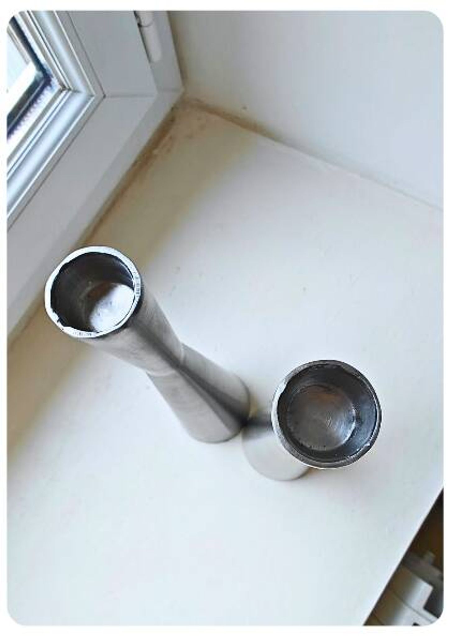 Pair of vintage brushed metal candlesticks