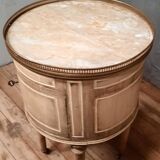 Round bedside table painted in trompe l'oeil