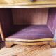 Pair of Art Deco curved bedside tables in light wood.