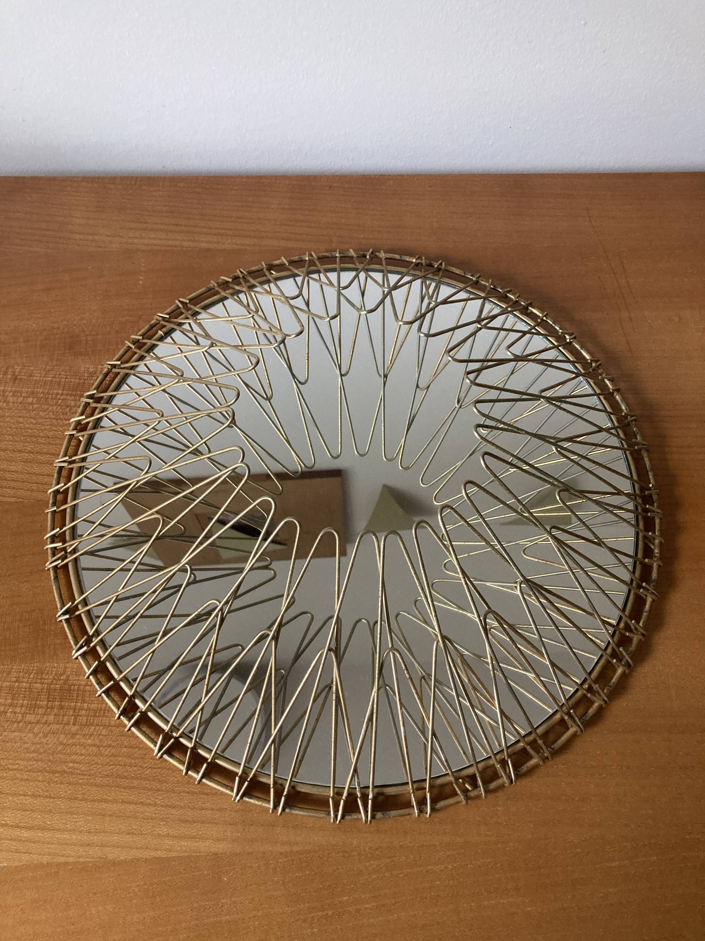 Sun mirror in gilded metal