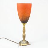 Art Nouveau lamp in bronze and orange marbled glass, 1920.