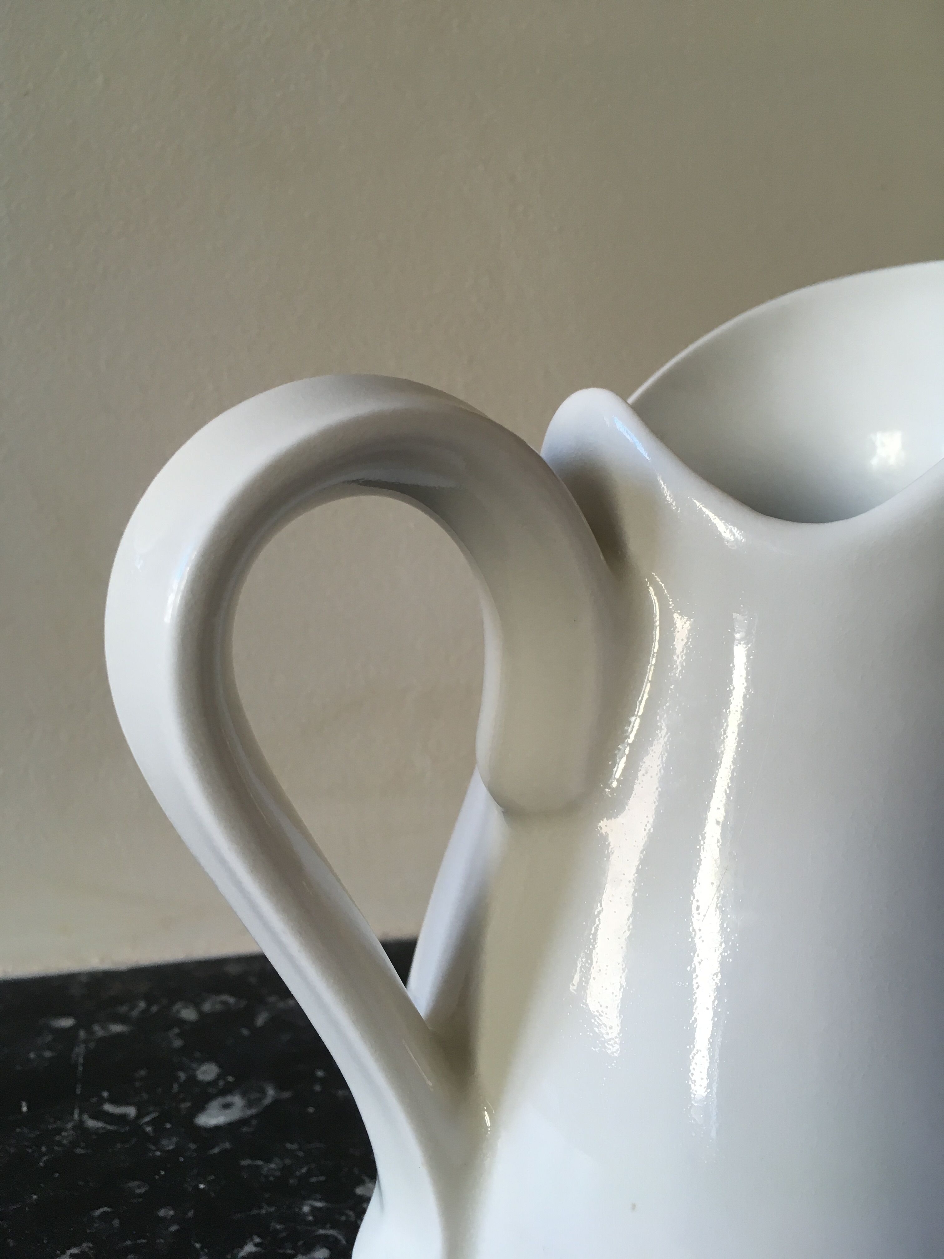 Broc in white fire porcelain with large spout