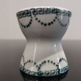 Old porcelain diabolo egg cup decorated with green frieze and garlands