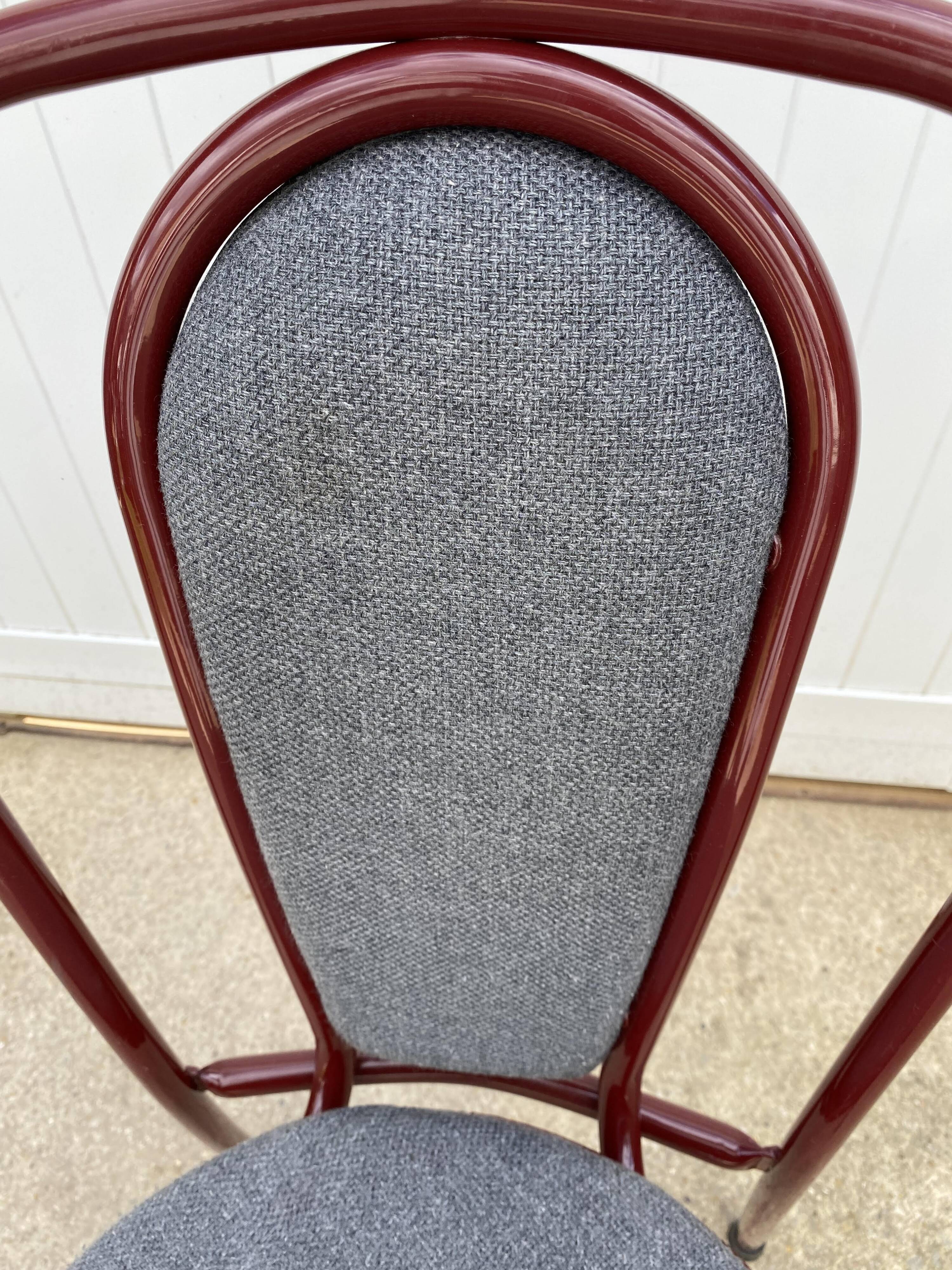 Metallic burgundy bistro chair for restaurants and communities with gray fabric