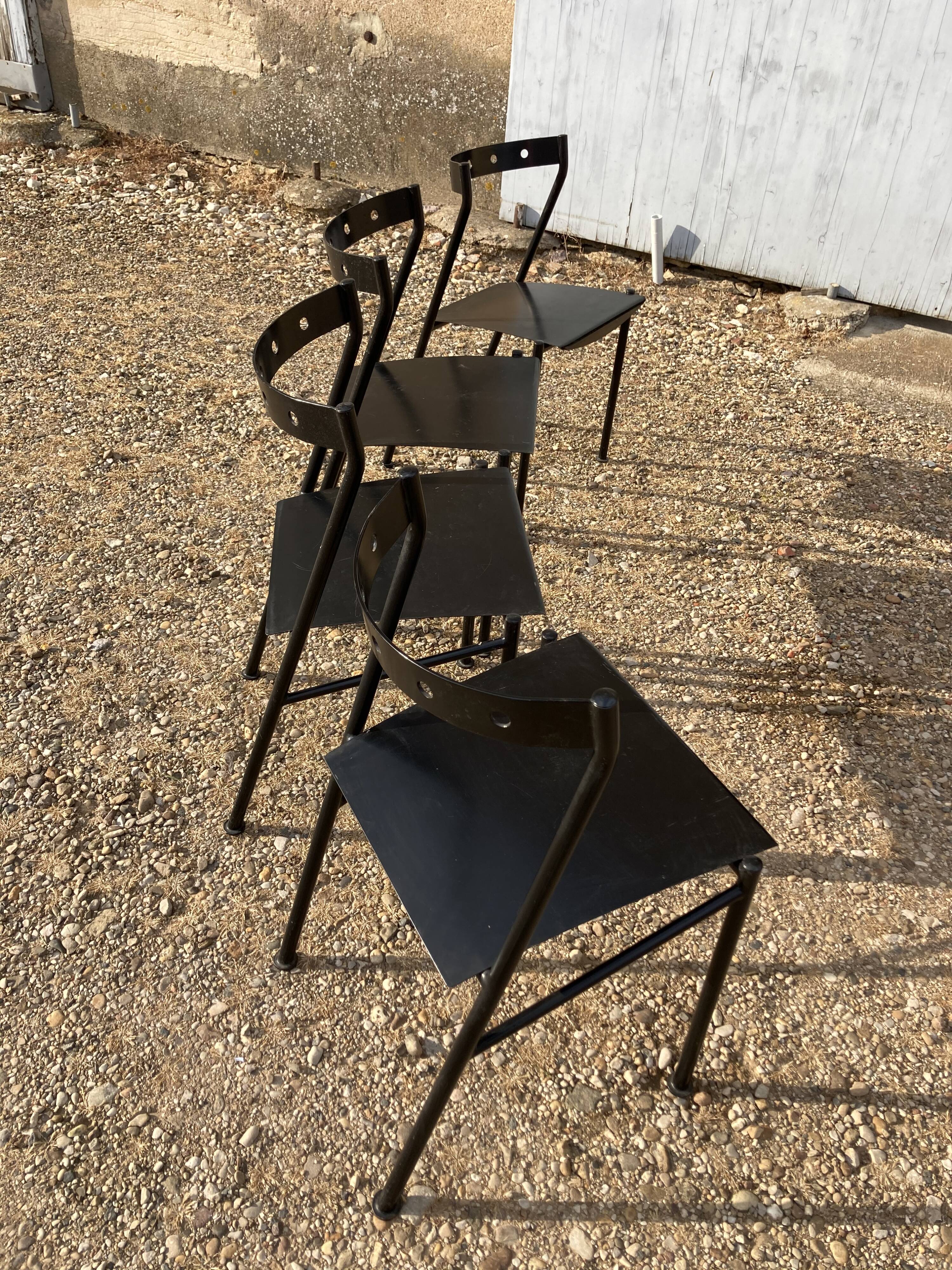 Series of 4 black iron chairs