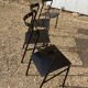 Series of 4 black iron chairs