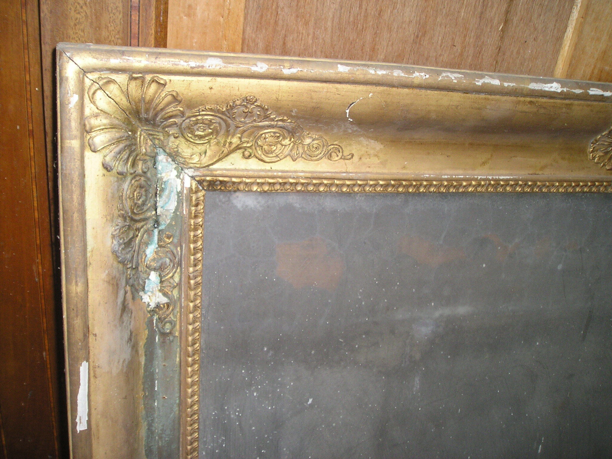 Antique wooden mirror and gilded stucco with gold leaf 89 x 72