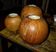 Set of 3 spherical olive wood candle holders in boho style.