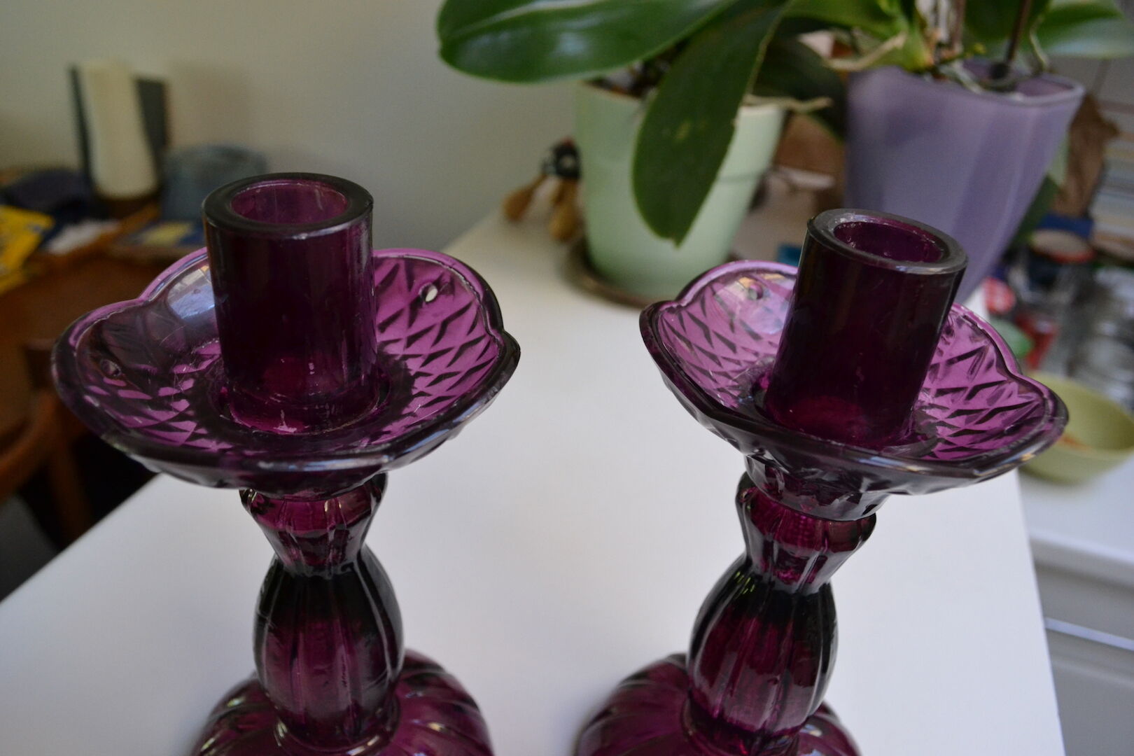 Pair of purple glass candlesticks