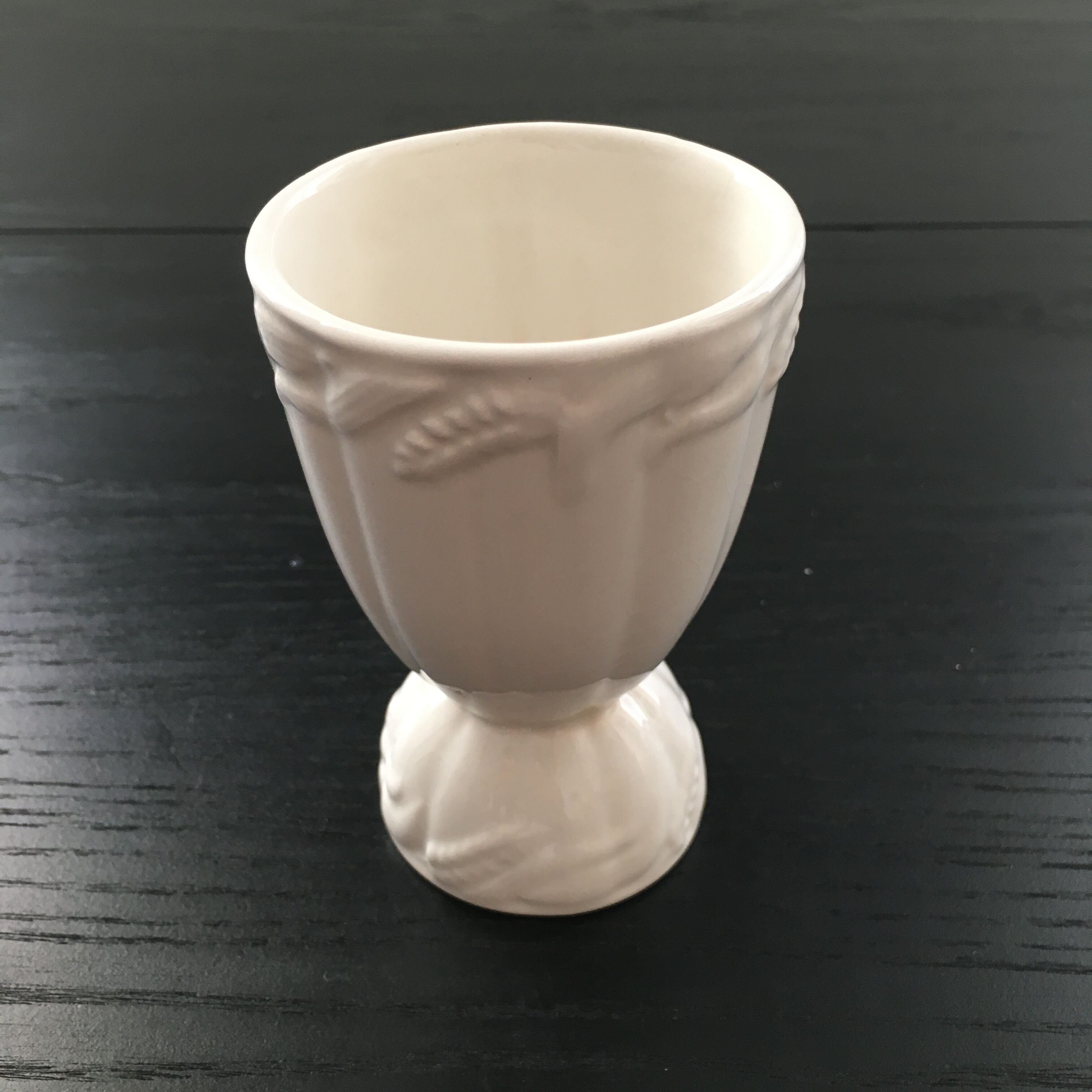 White vase with wheat decoration.