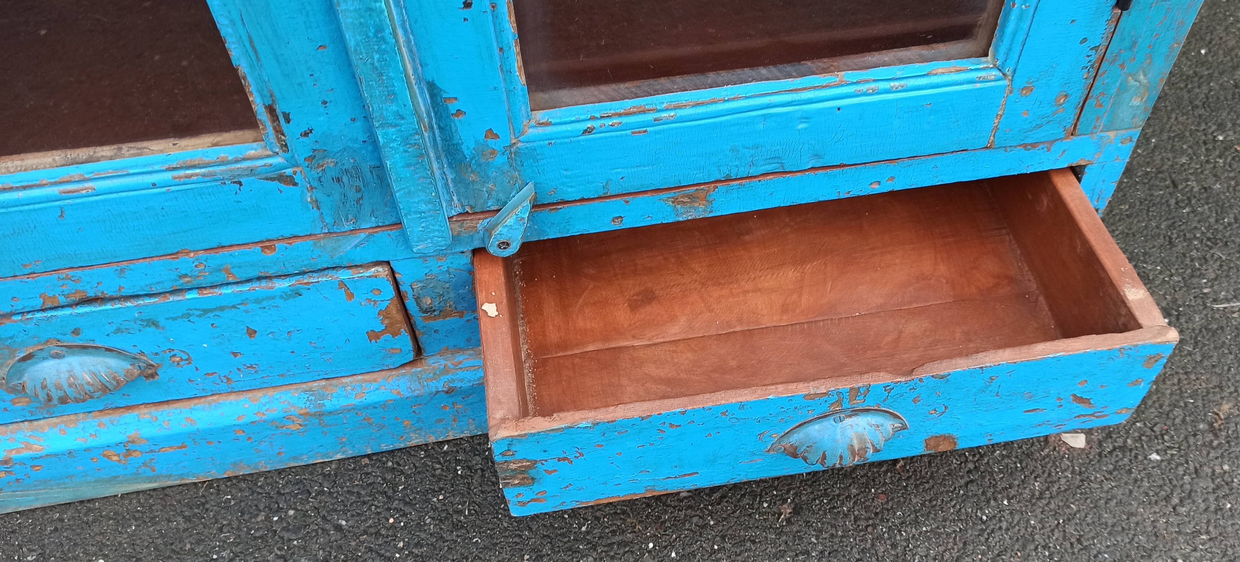 Old wooden glazed cabinet with two doors and two drawers