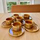 6 stoneware cups and 6 enamel plates