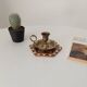 Vintage brass candle holder in gold.