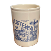 White ceramic pot with vintage utensils