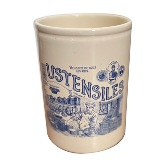 White ceramic pot with vintage utensils