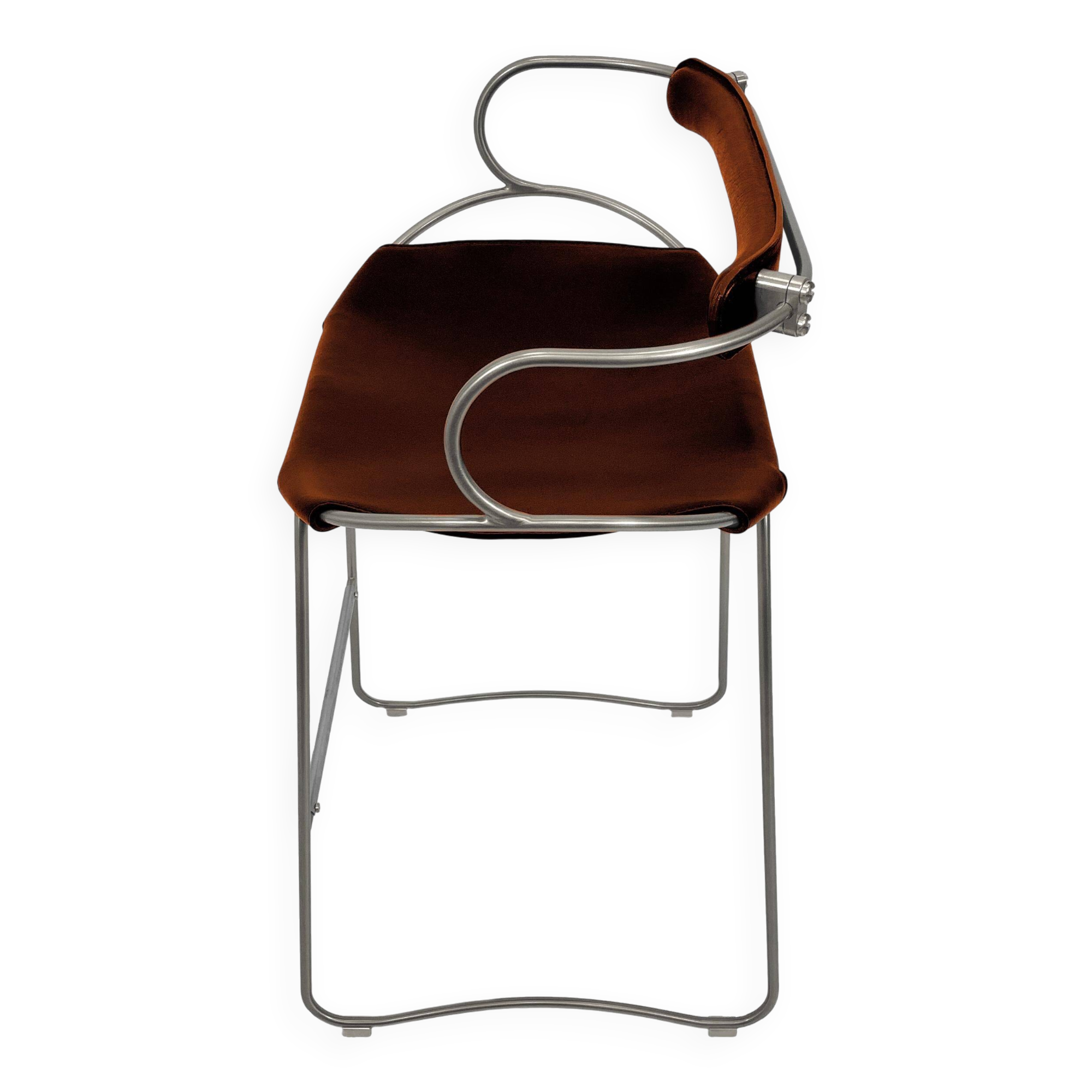 Sculptural bar stool with a silver metal back and old cognac leather.