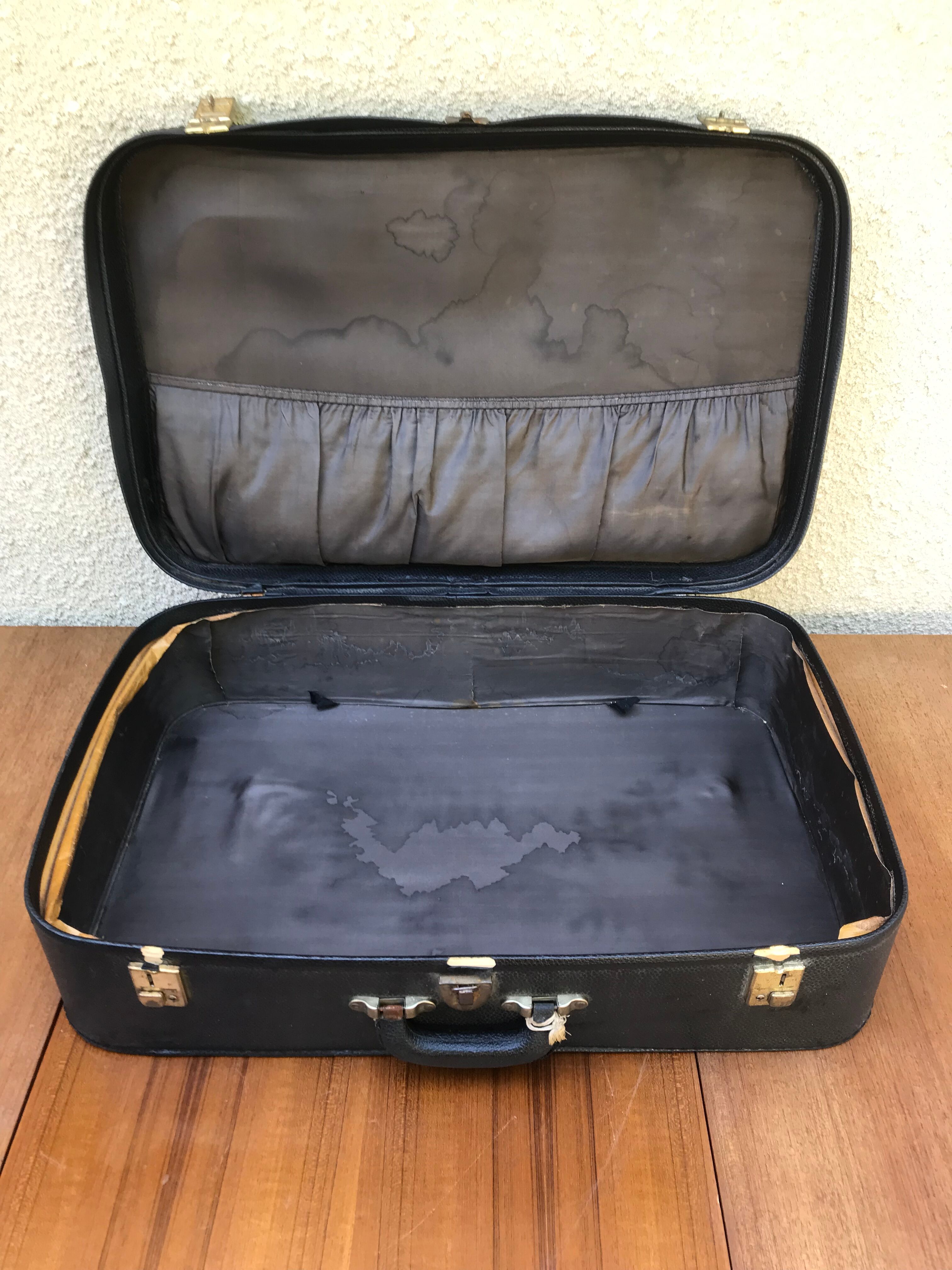 Former skai black travel suitcase