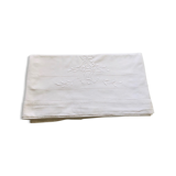 Old flat sheet embroidered and hand-opened