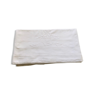 Old flat sheet embroidered and hand-opened