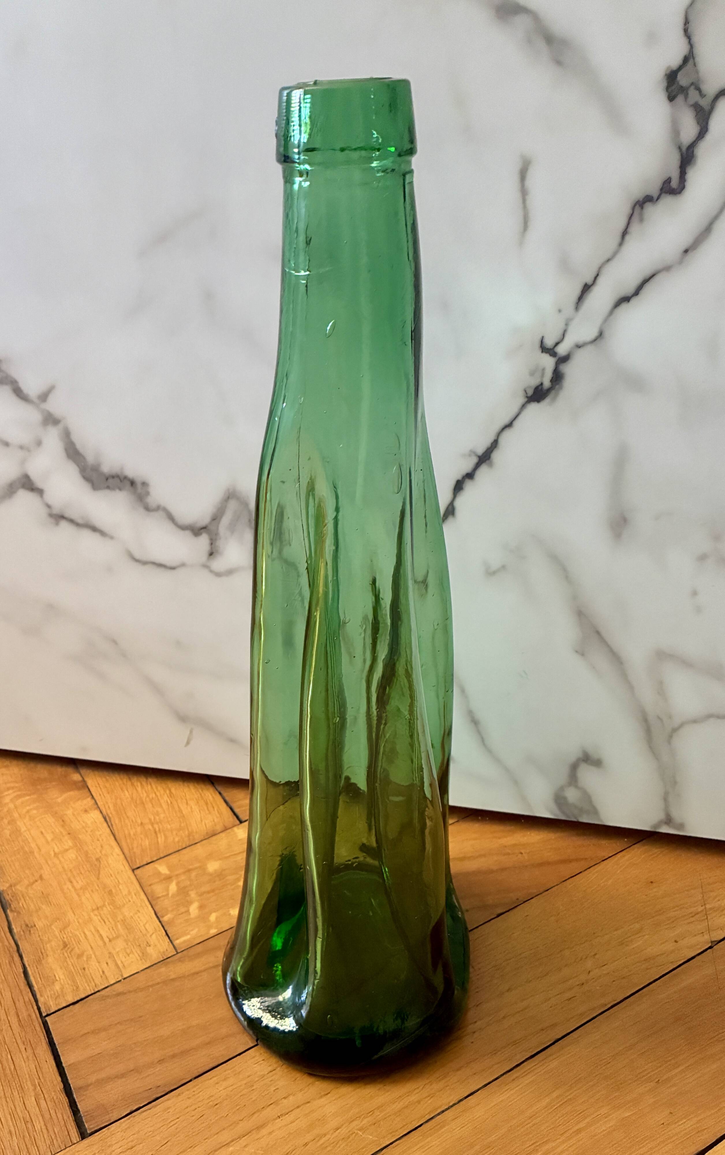 Vintage Viresa bottle in a flattened shape.