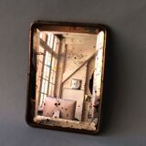 Antique travel mirror with a wide bevel